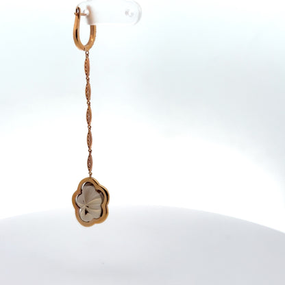 Floral shaped smoky topaz gem hanging from a chain made from diamonds with a rose gold lock earring