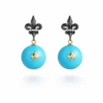 Okside Gümüş Fleur de Lis ve Firuze Top Detaylı Küpe
